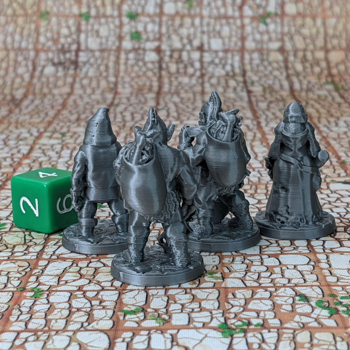 a group of wizard figurines sitting on a table